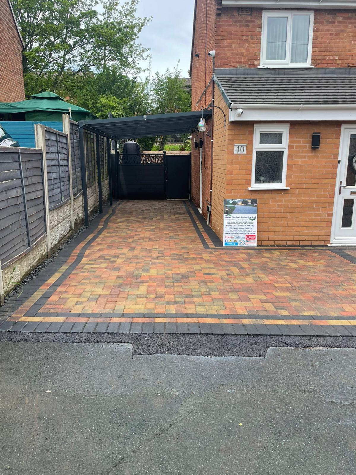 Autumn blend block driveway under a carport