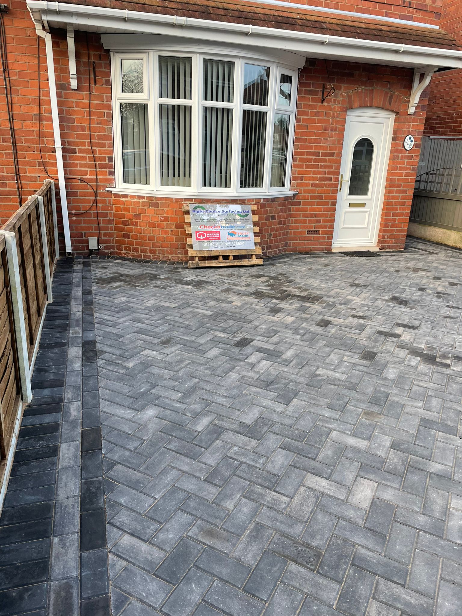 Charcoal herringbone block paved driveway