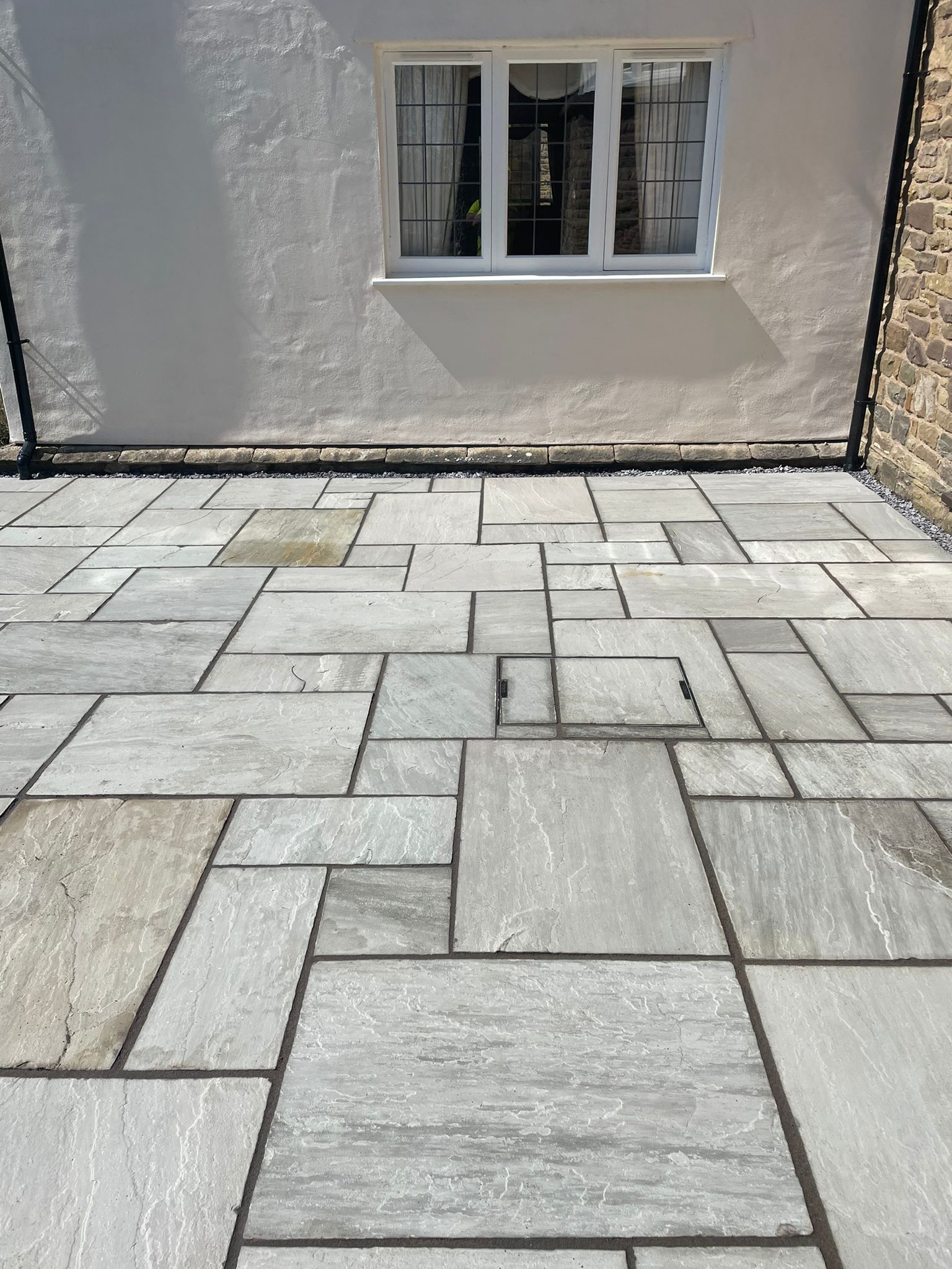 Kandla grey sandstone patio at a rendered cottage